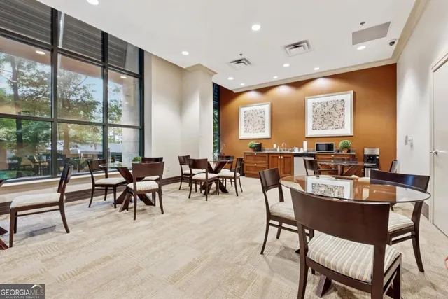 a view of a a dining room with furniture window and outside view