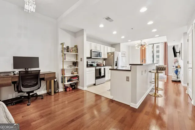 a view of a kitchen with workspace and a window