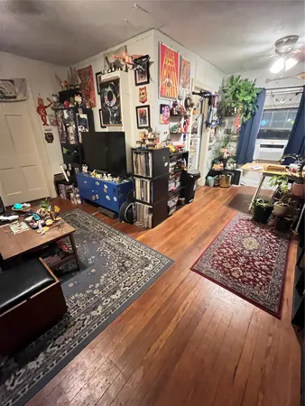 a view of a living room and dining area