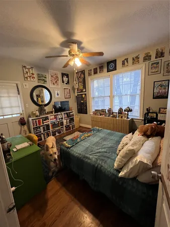 a bed room with a bed furniture and a tv