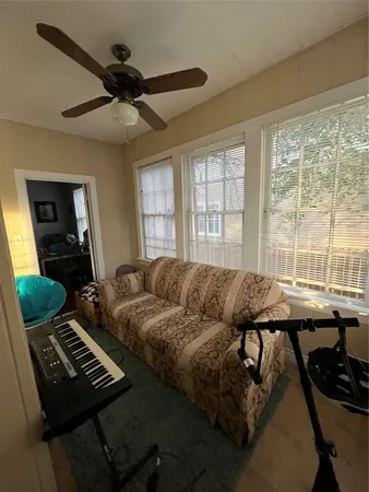 a living room with couches and a window