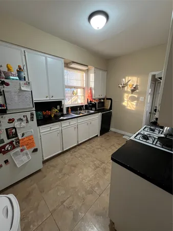 a kitchen that has a sink and a stove