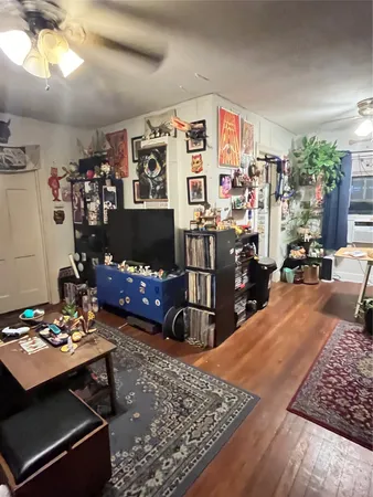 a living room with lots of furniture and a dining table
