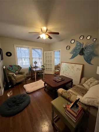 a living room with furniture and a window