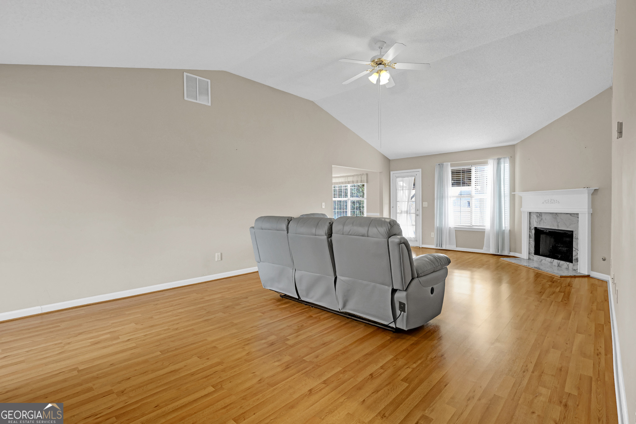 313 Harris Avenue Locust Grove, GA 30248 - Photo 14 of 34 a living room with furniture and a fireplace