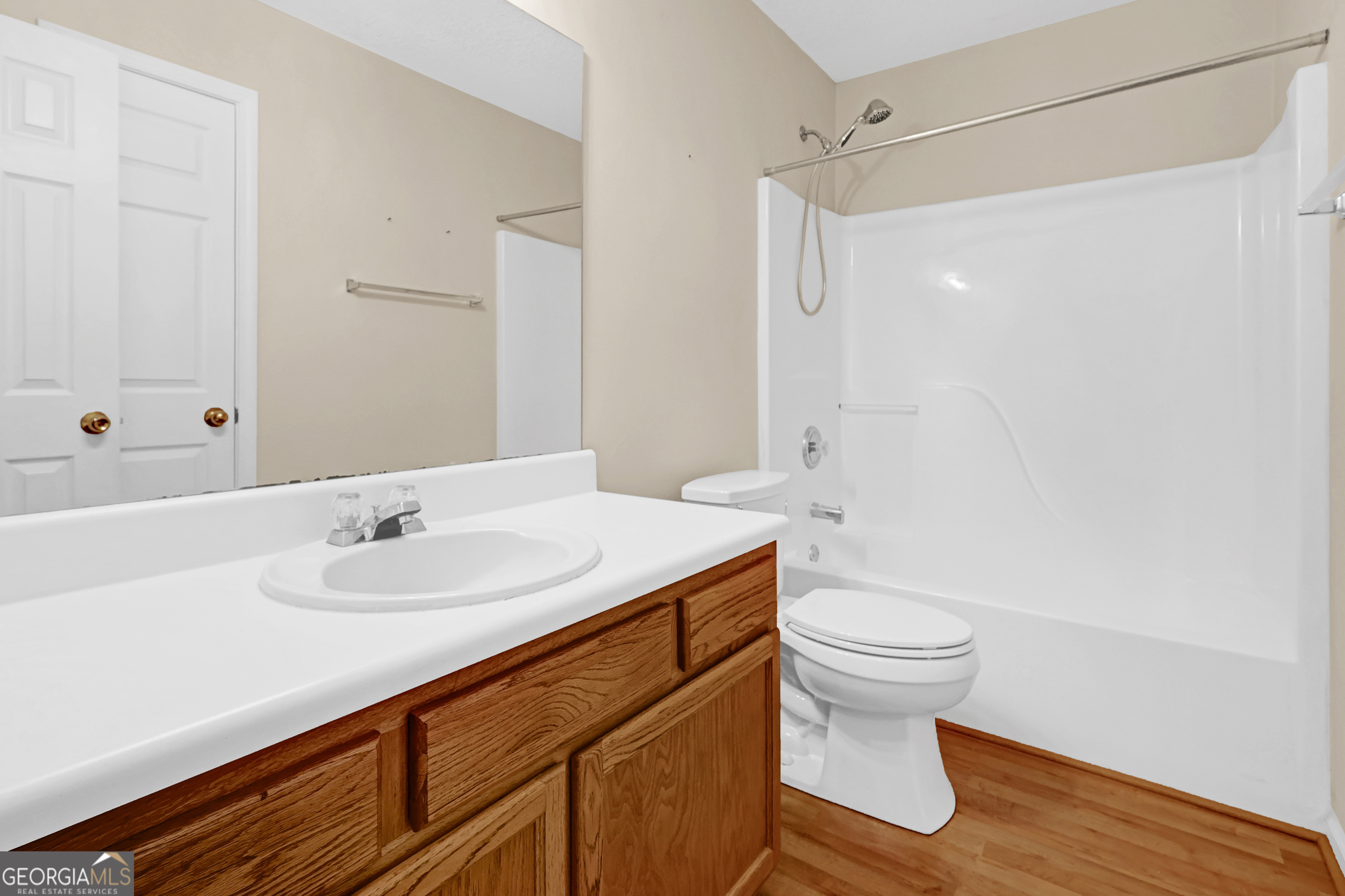 313 Harris Avenue Locust Grove, GA 30248 - Photo 18 of 34 a bathroom with a sink a toilet and shower