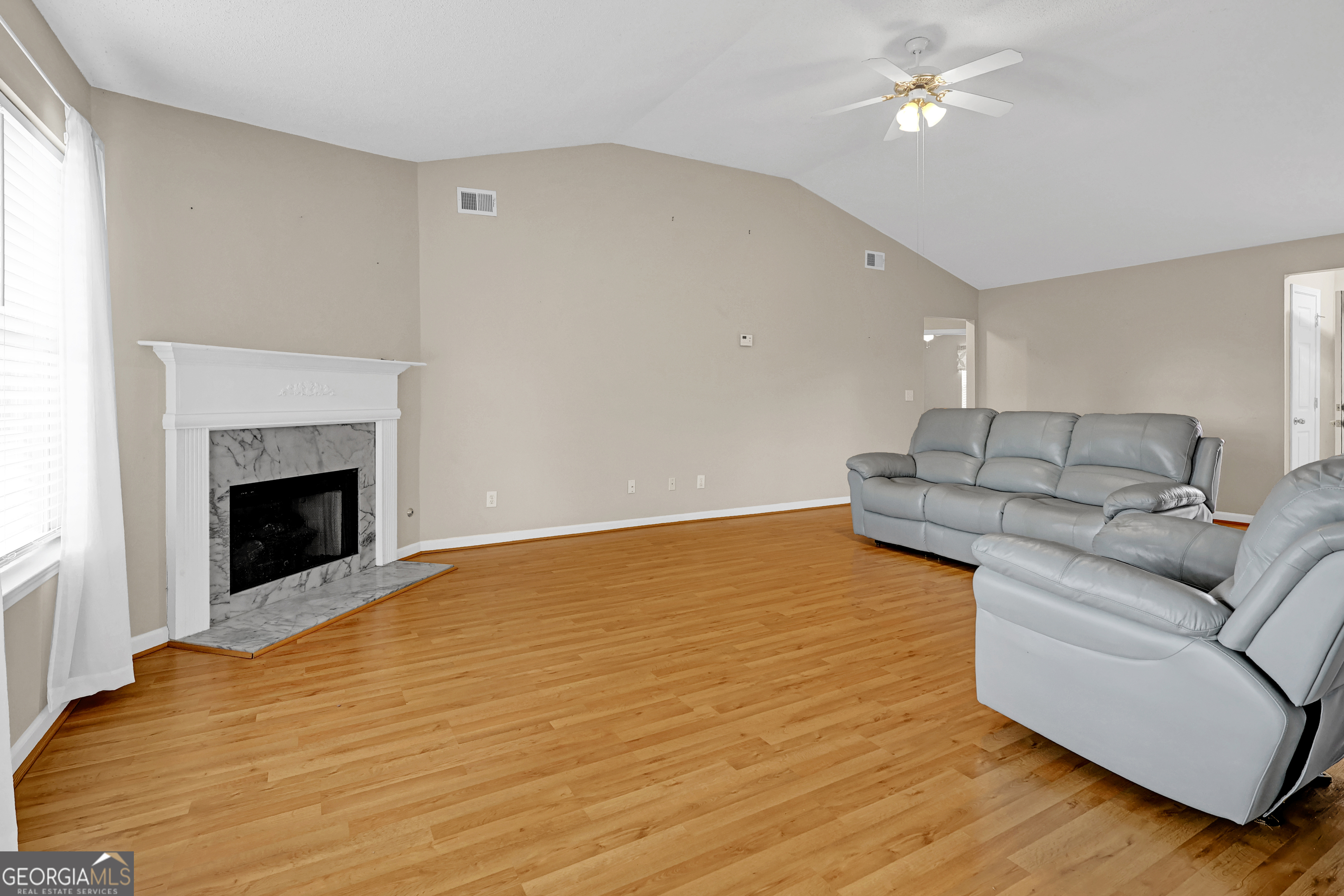313 Harris Avenue Locust Grove, GA 30248 - Photo 21 of 34 a living room with furniture and a fireplace