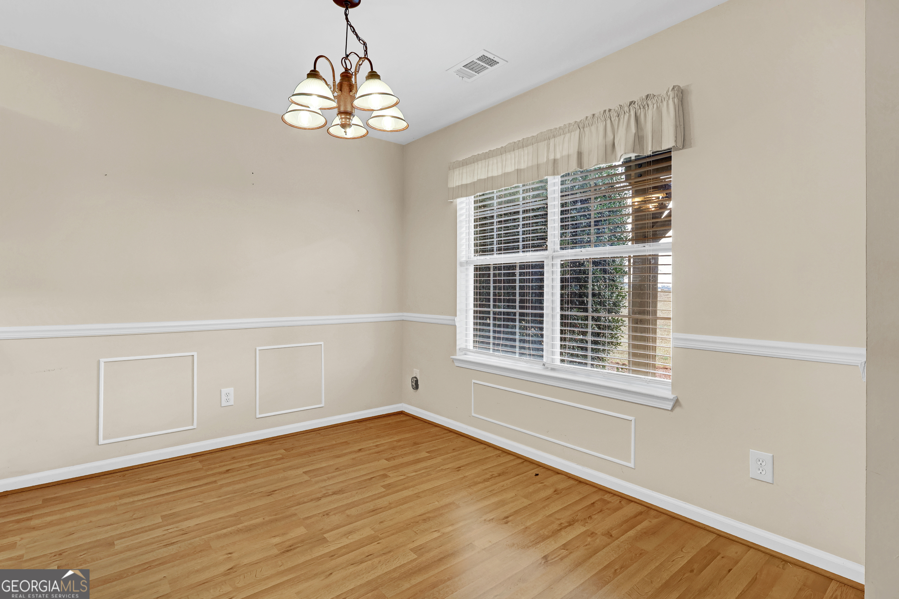 313 Harris Avenue Locust Grove, GA 30248 - Photo 22 of 34 a view of empty room with wooden floor and fan