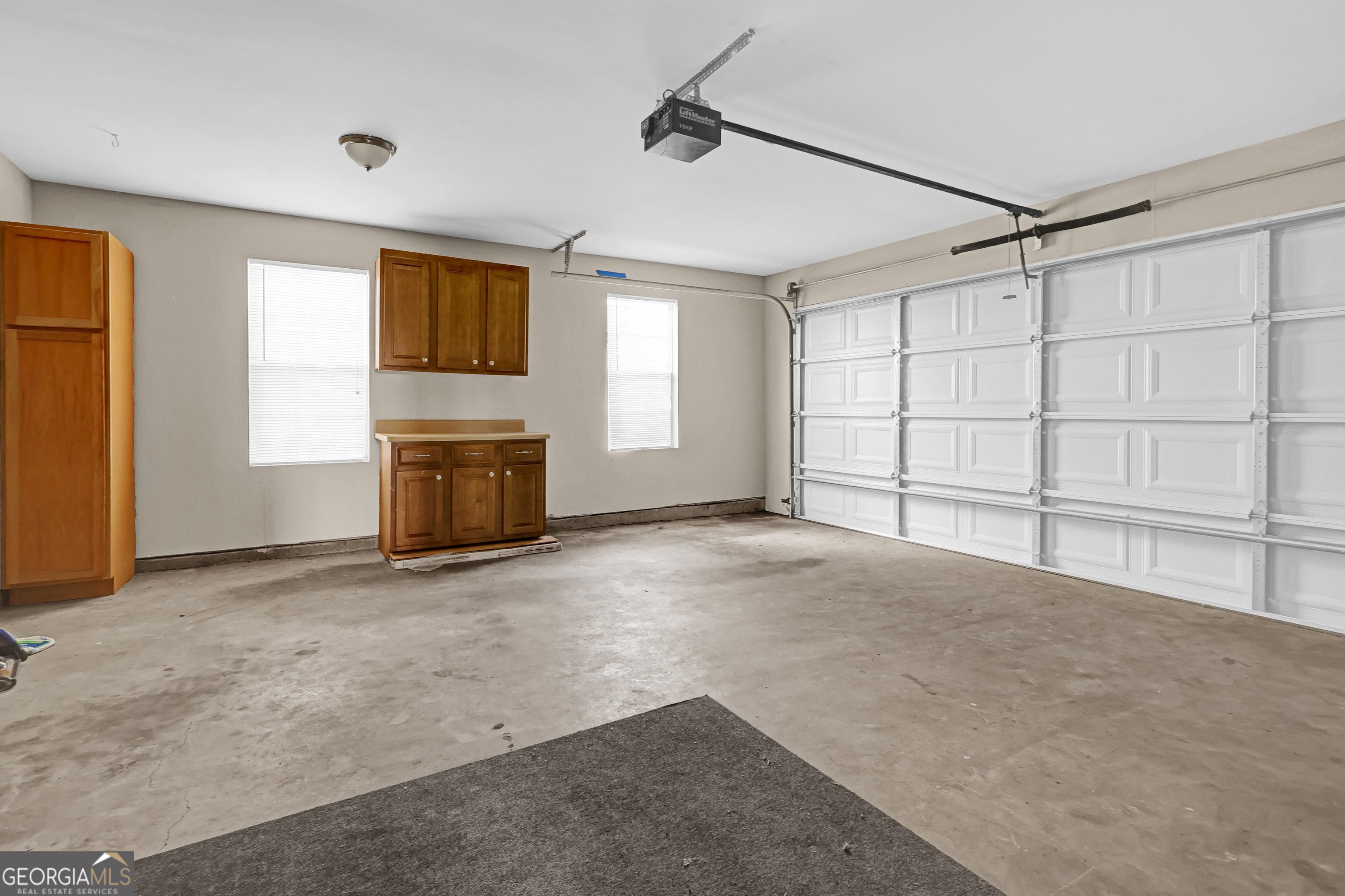 313 Harris Avenue Locust Grove, GA 30248 - Photo 27 of 34 an empty room with windows and fireplace