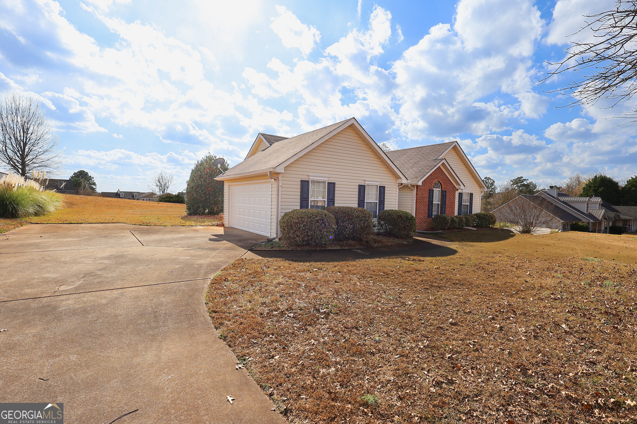 313 Harris Avenue Locust Grove, GA 30248 - Photo 5 of 34 a view of an house with backyard and mountain view