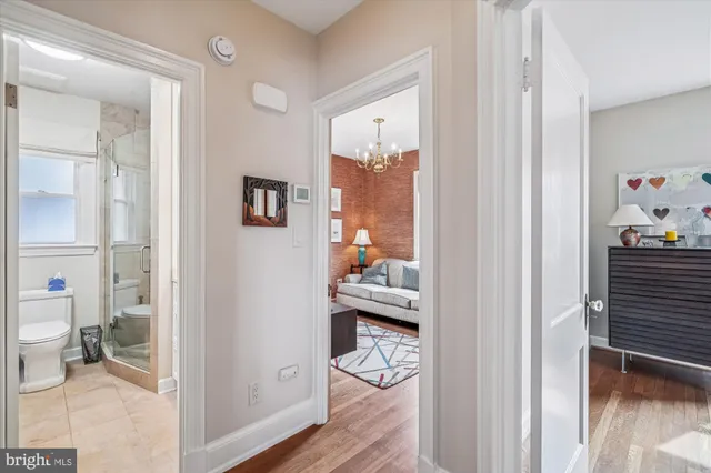 a view of living room and wooden floor