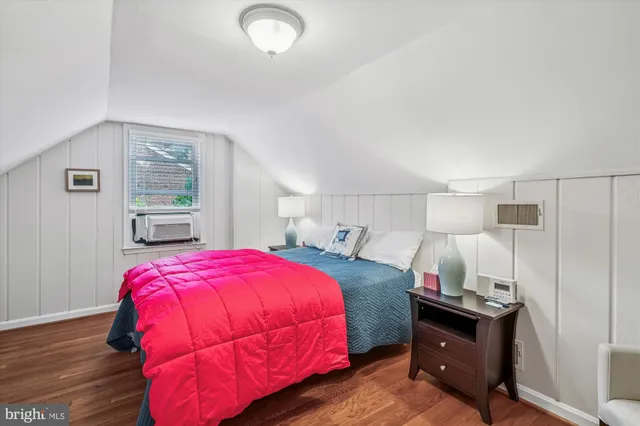 a bed sitting in a bedroom and table