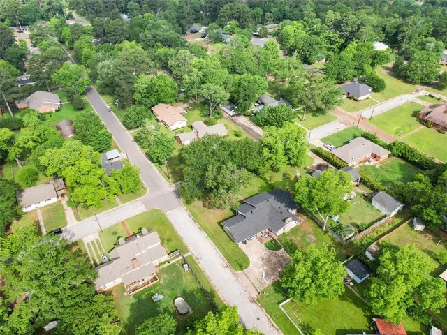 an aerial view of residential house with outdoor space
