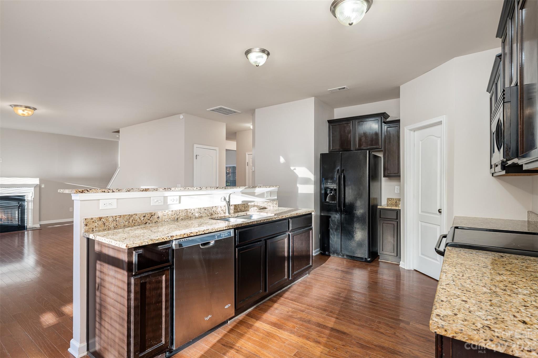 13225 Chelsea Ridge Lane Huntersville, NC 28078 - Photo 11 of 40 a kitchen with stainless steel appliances granite countertop a stove and a refrigerator