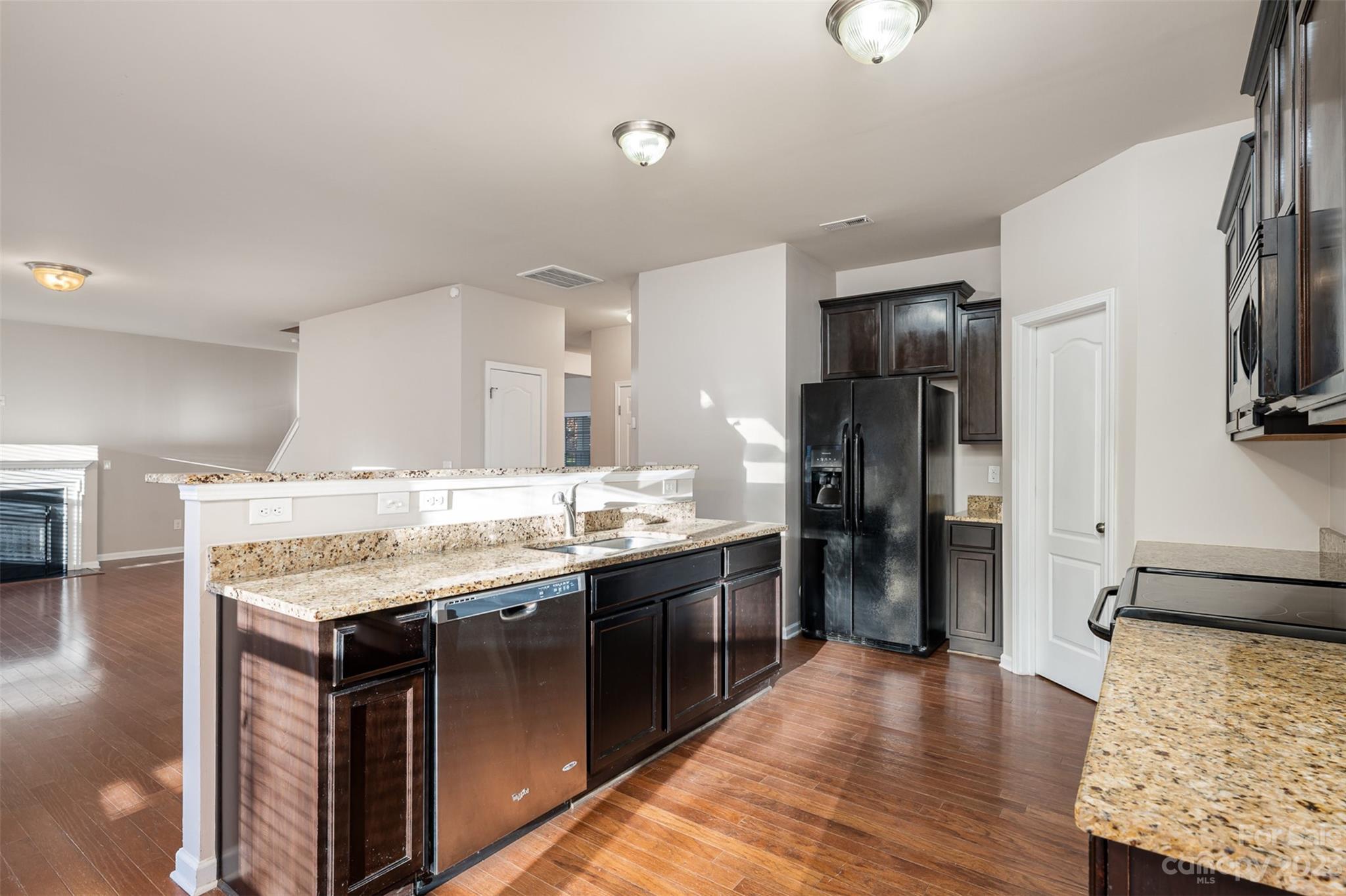 13225 Chelsea Ridge Lane Huntersville, NC 28078 - Photo 12 of 40 a kitchen with stainless steel appliances granite countertop a stove and a refrigerator