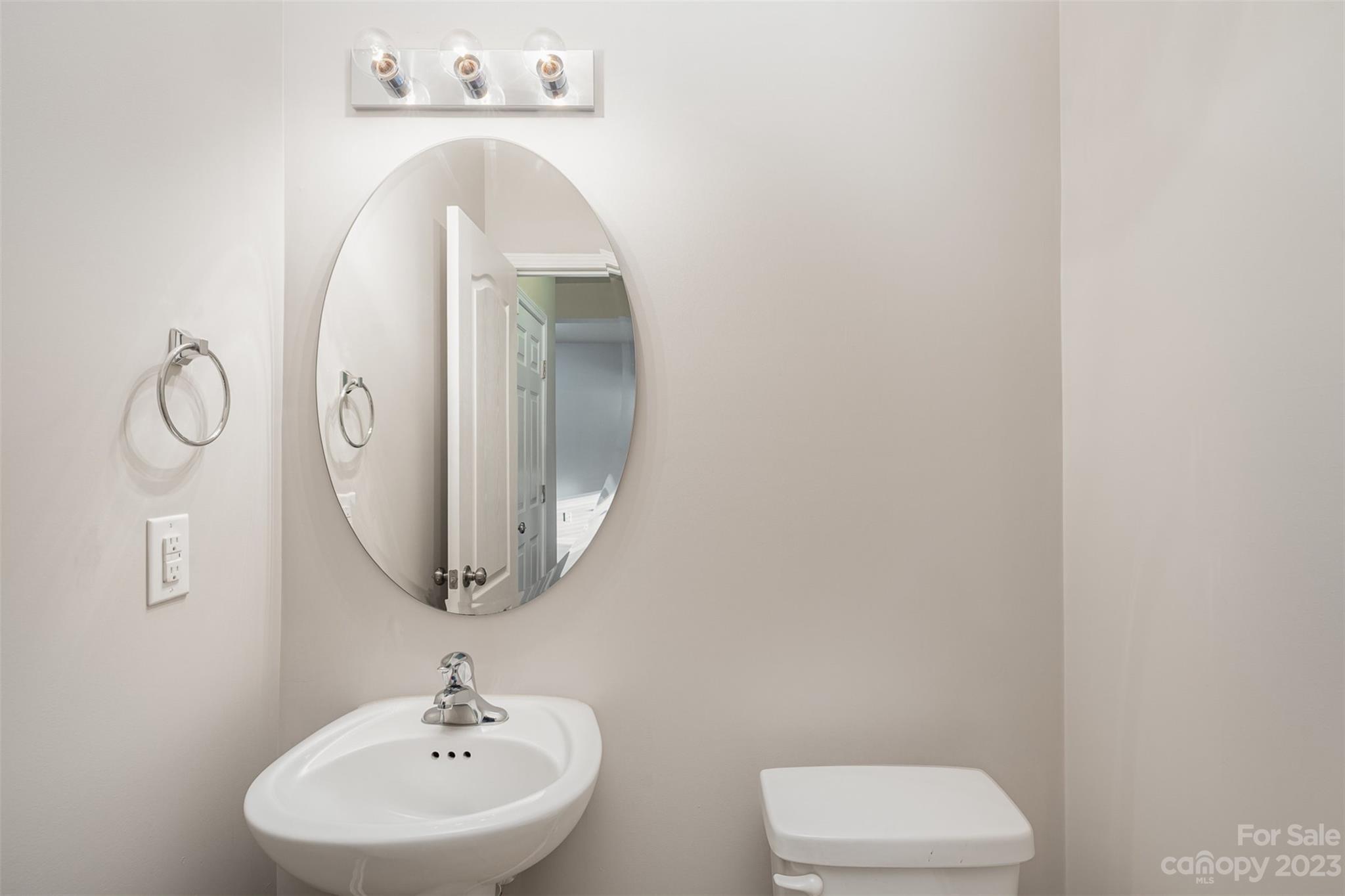 13225 Chelsea Ridge Lane Huntersville, NC 28078 - Photo 16 of 40 a bathroom with a toilet sink and mirror