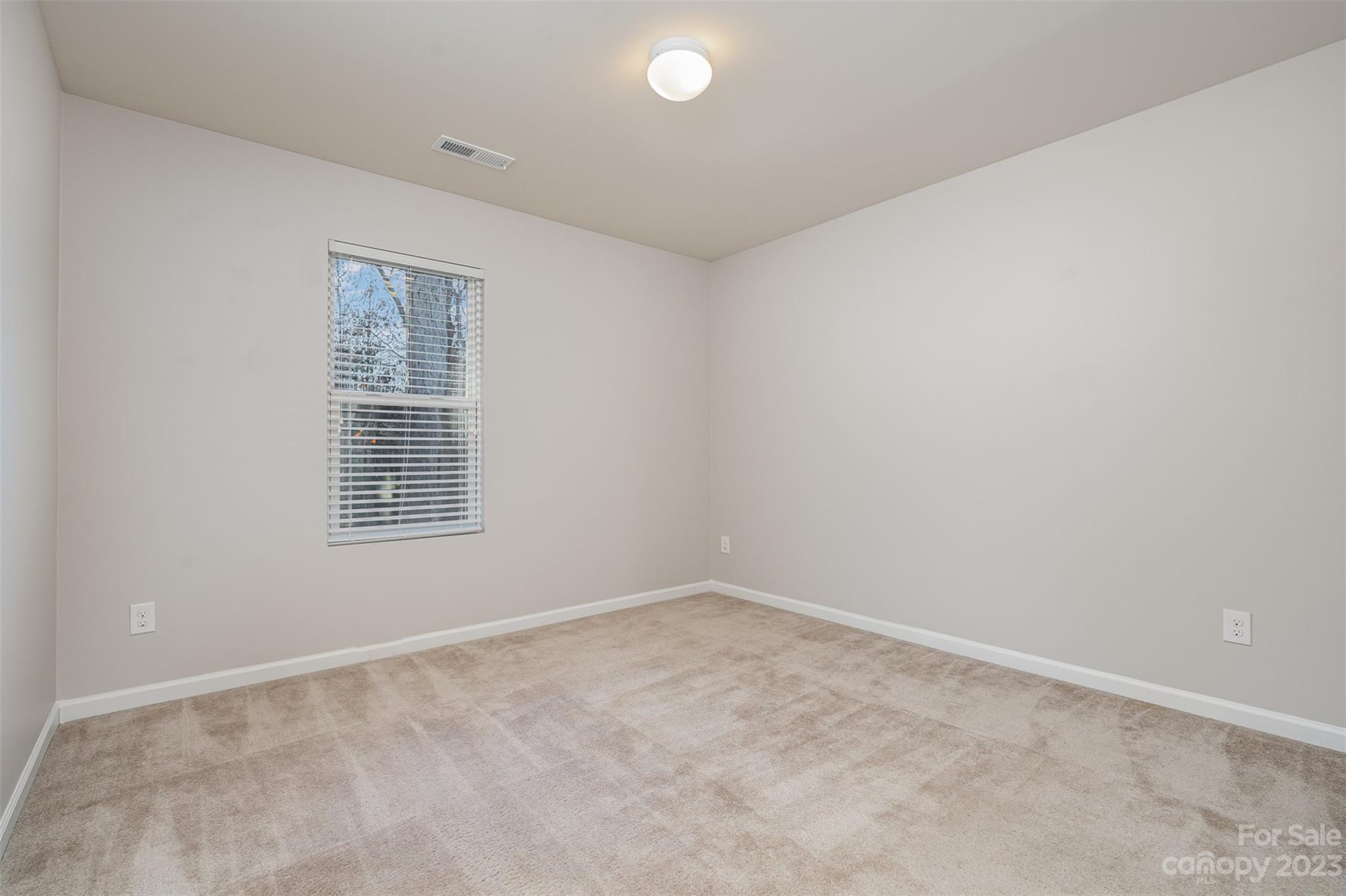 13225 Chelsea Ridge Lane Huntersville, NC 28078 - Photo 17 of 40 an empty room with a window