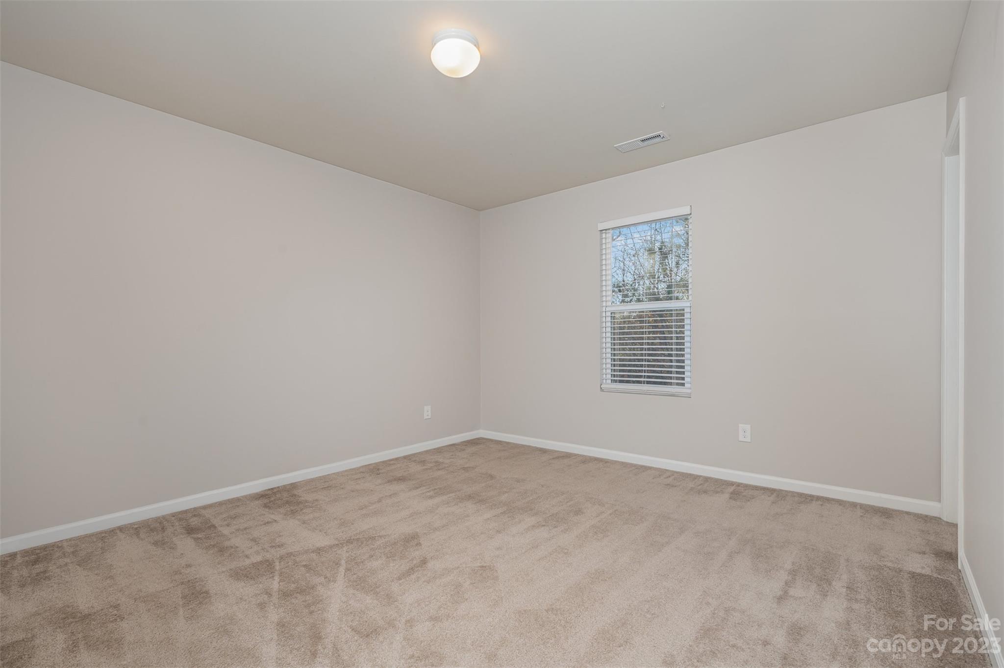 13225 Chelsea Ridge Lane Huntersville, NC 28078 - Photo 20 of 40 an empty room with a window