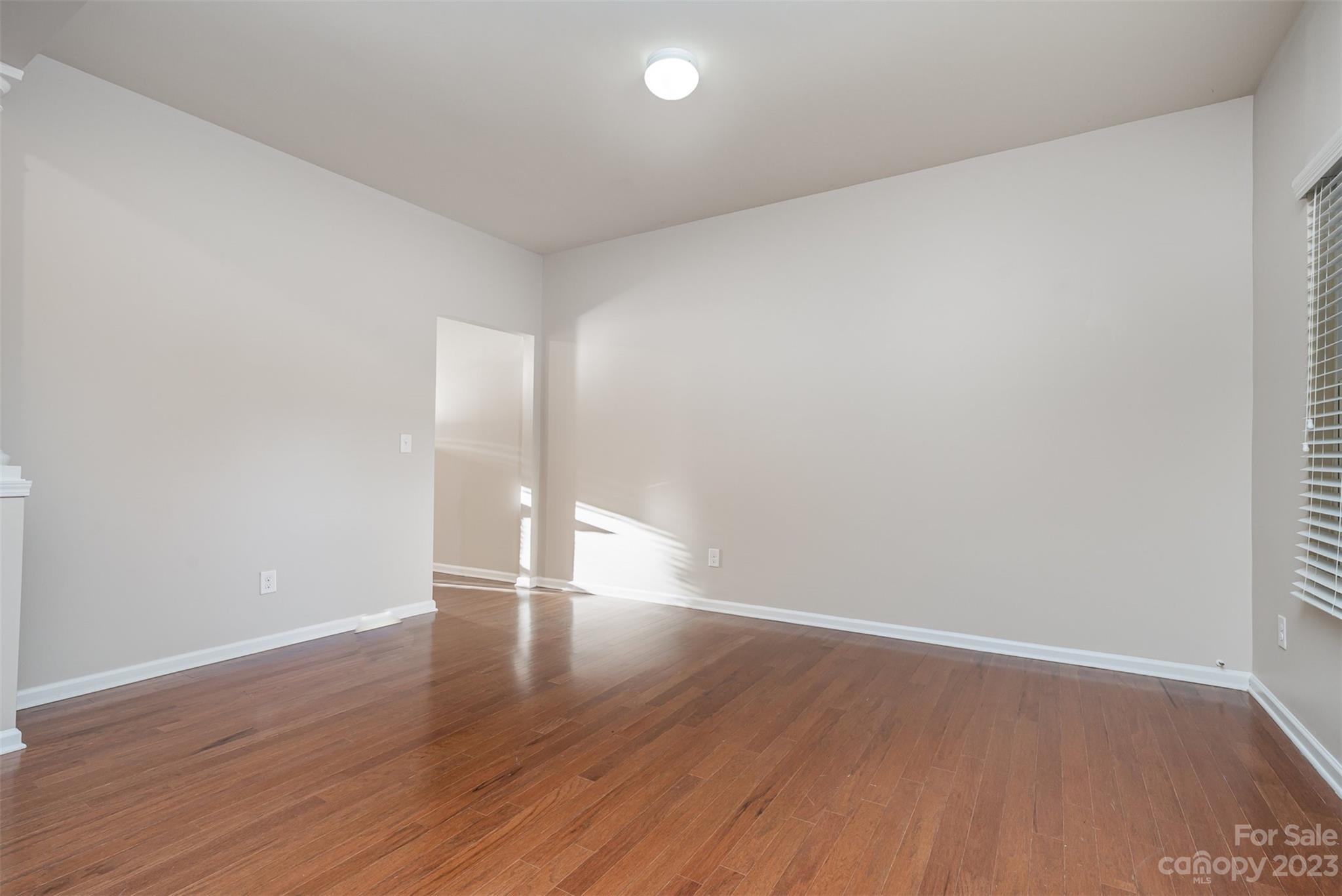 13225 Chelsea Ridge Lane Huntersville, NC 28078 - Photo 3 of 40 a view of an empty room with wooden floor