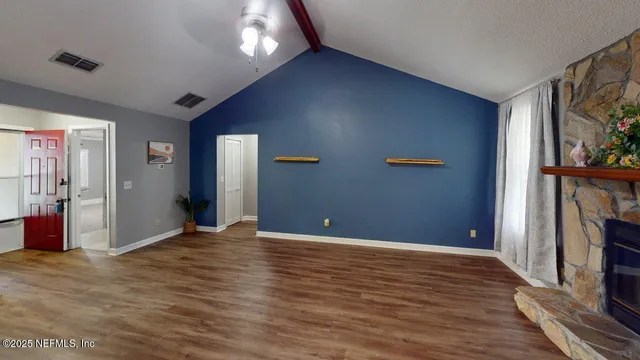 a view of a livingroom with furniture and windows