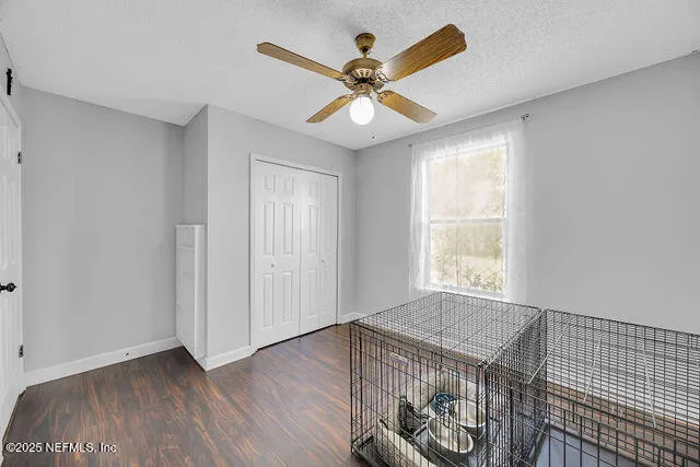 a bedroom with a bed a desk and chair