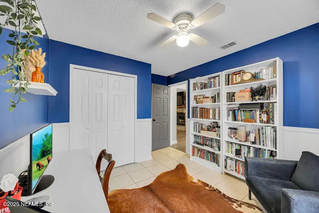 a front view of a house with a garden and yard