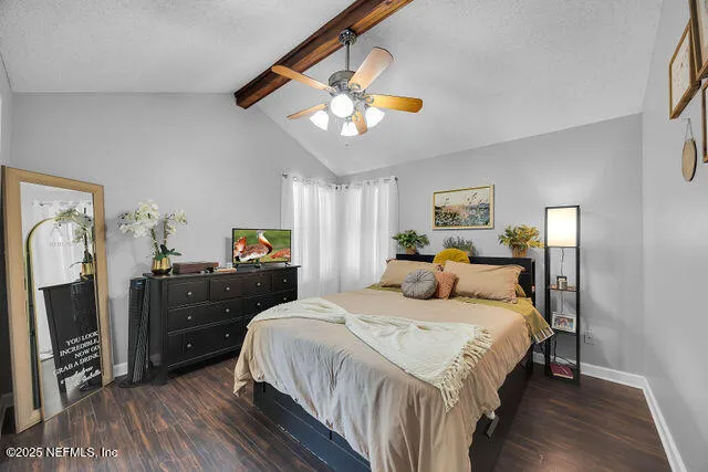 a dirt road with a house in the background