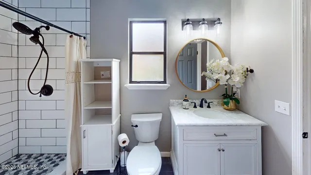 a front view of house with yard and trees in the background