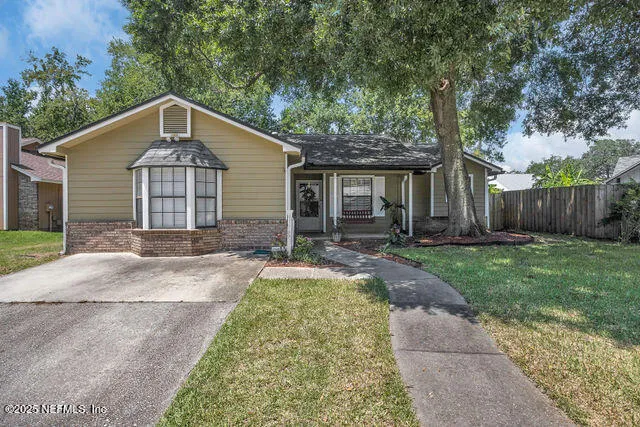 front view of a house with a yard