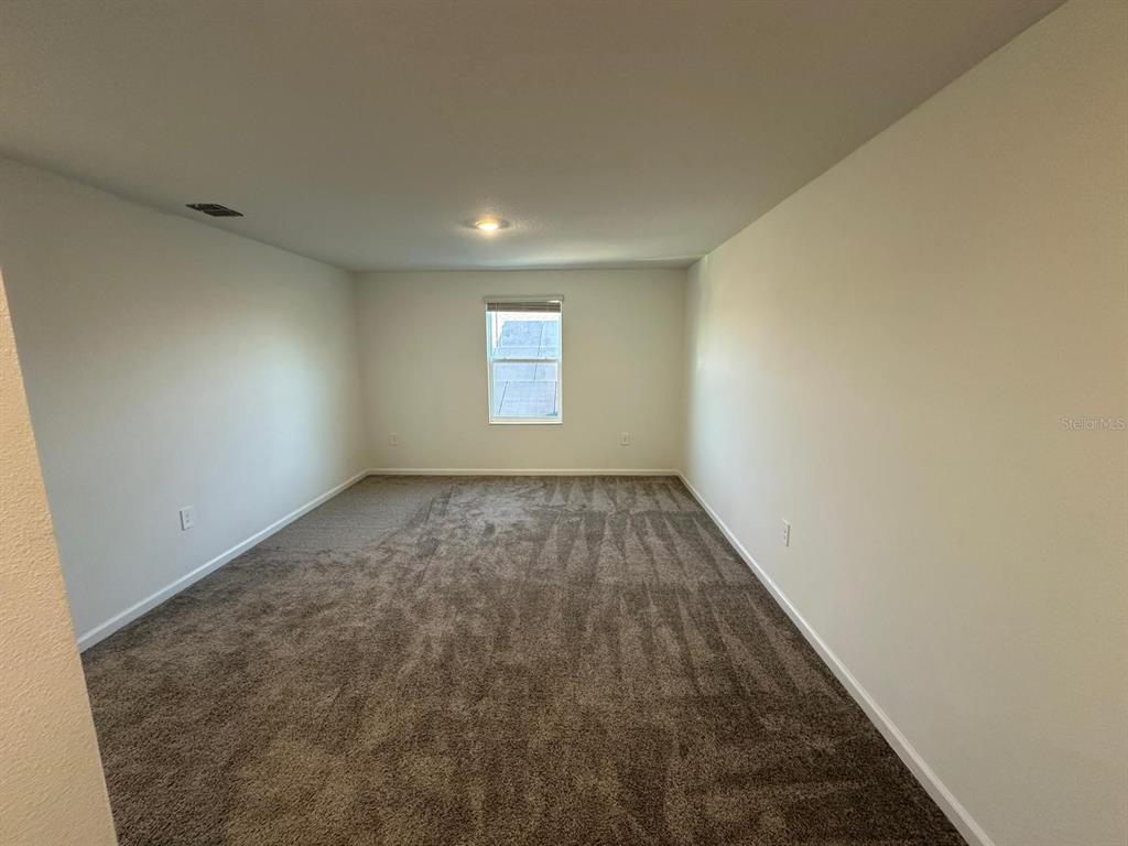 2275 Pocky Way Kissimmee, FL 34746 - Photo 14 of 25 an empty room with windows