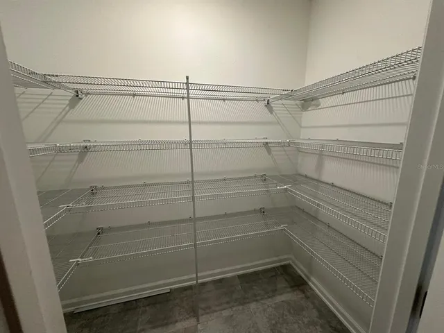 a view of a room with racks on the wall