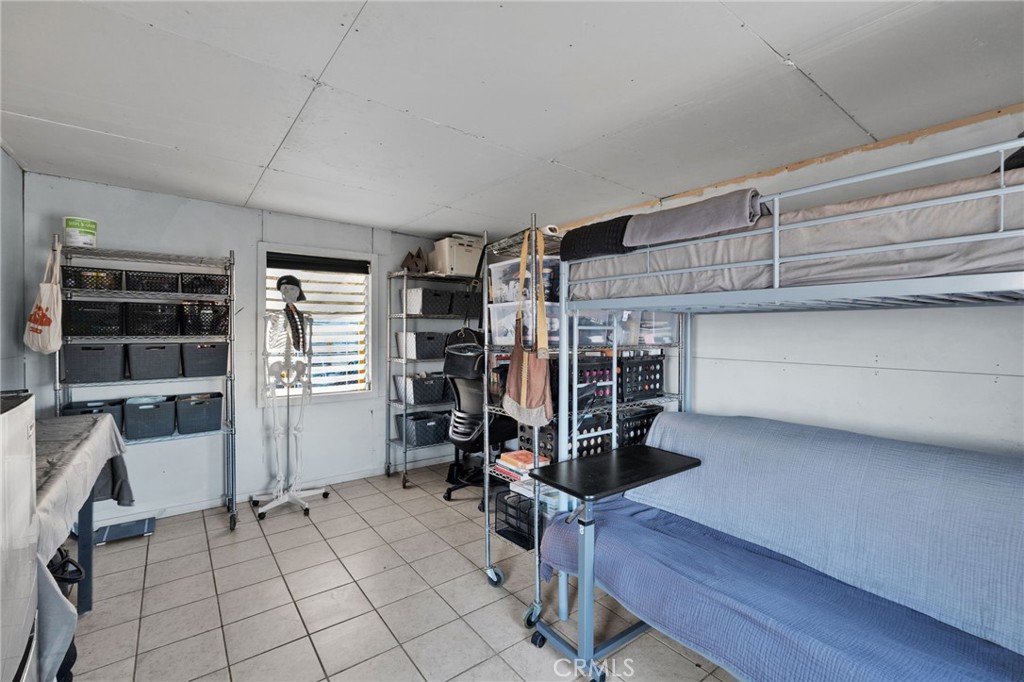 68476 Pole Line Road Twentynine Palms, CA 92277 - Photo 11 of 25 a view of room with racks on the wall