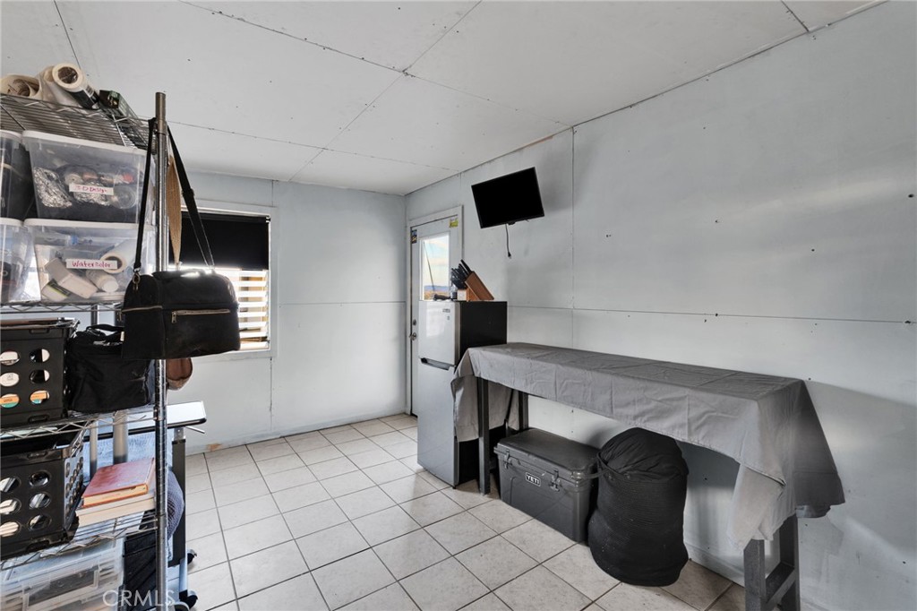 68476 Pole Line Road Twentynine Palms, CA 92277 - Photo 13 of 25 a view of workspace with furniture and natural light