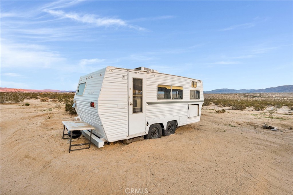 68476 Pole Line Road Twentynine Palms, CA 92277 - Photo 14 of 25 a view of a terrace with sky view