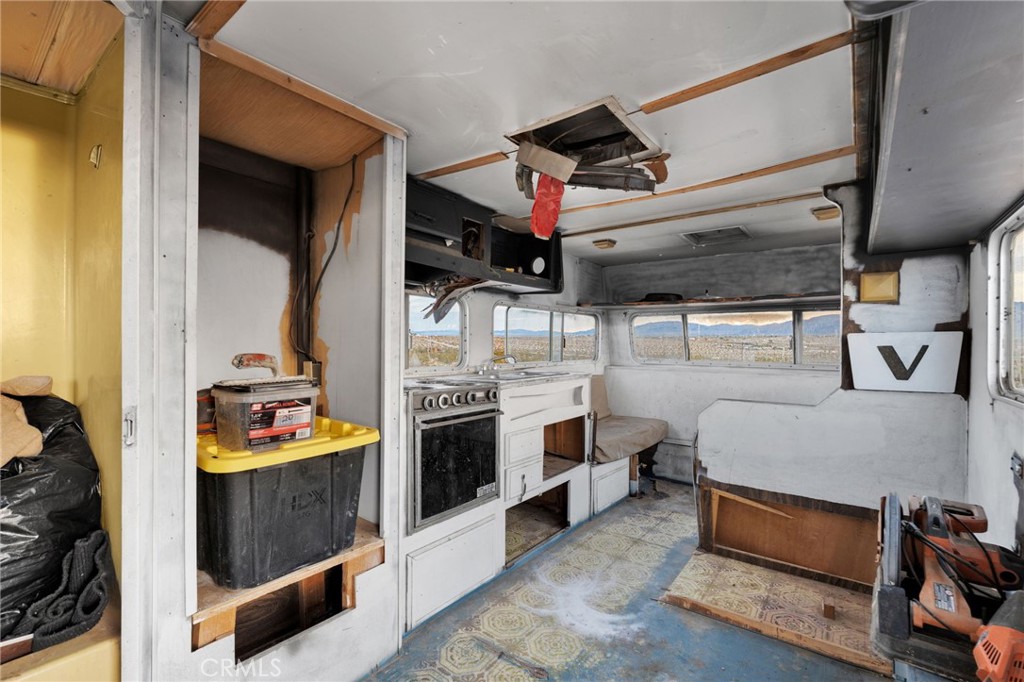 68476 Pole Line Road Twentynine Palms, CA 92277 - Photo 15 of 25 a bedroom with bed and cabinets