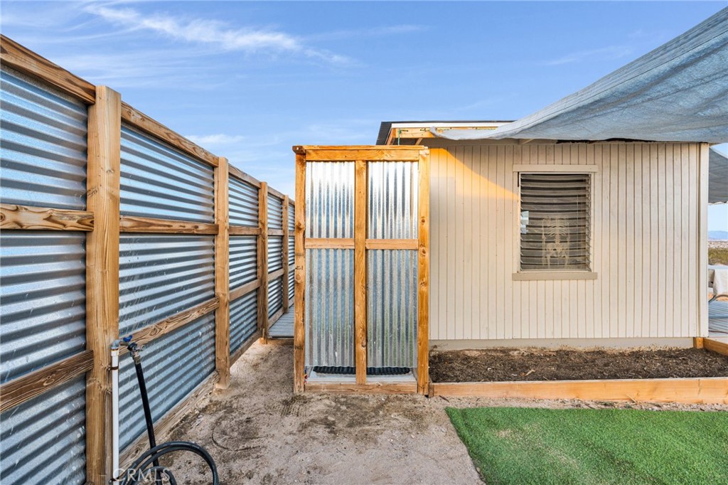 68476 Pole Line Road Twentynine Palms, CA 92277 - Photo 7 of 25 a view of a house with a backyard