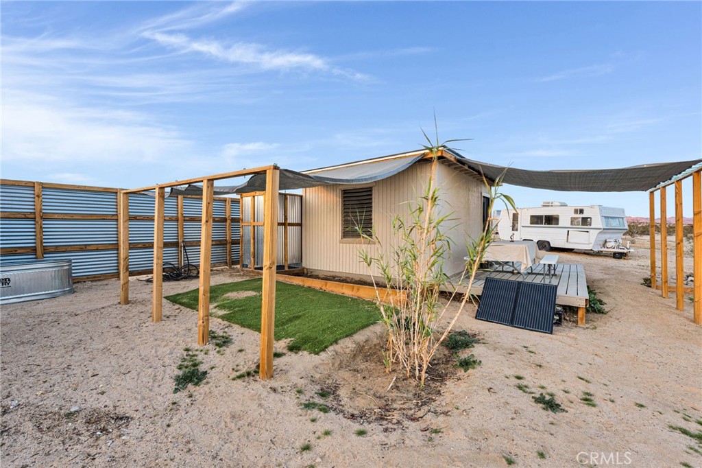 68476 Pole Line Road Twentynine Palms, CA 92277 - Photo 9 of 25 a view of a house with a yard