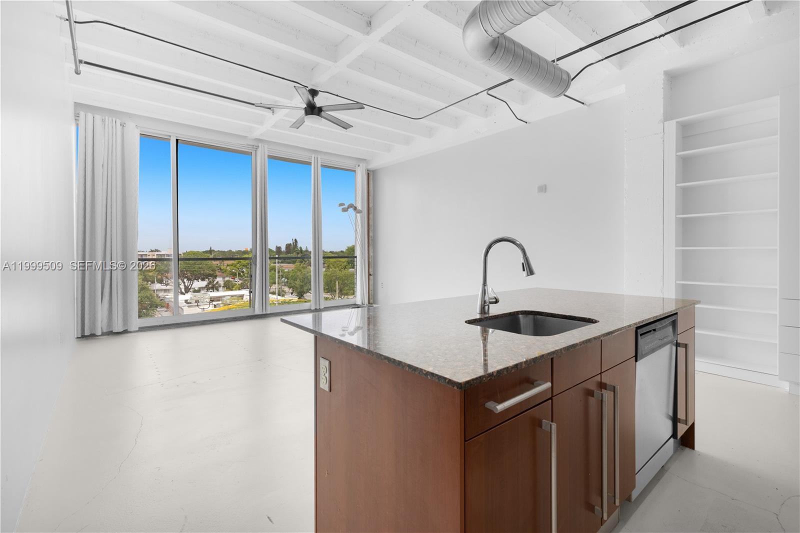 8101 Biscayne Boulevard, Unit R414 Miami, FL 33138 - Photo 9 of 27 a kitchen with a sink and a window