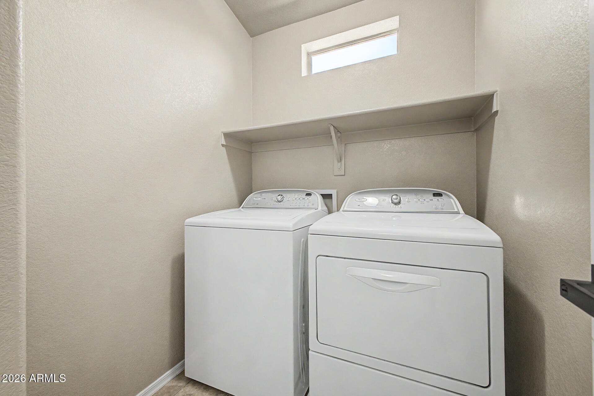 2725 East Mine Creek Road, Unit 2172 Phoenix, AZ 85024 - Photo 23 of 28 a utility room with dryer and washer