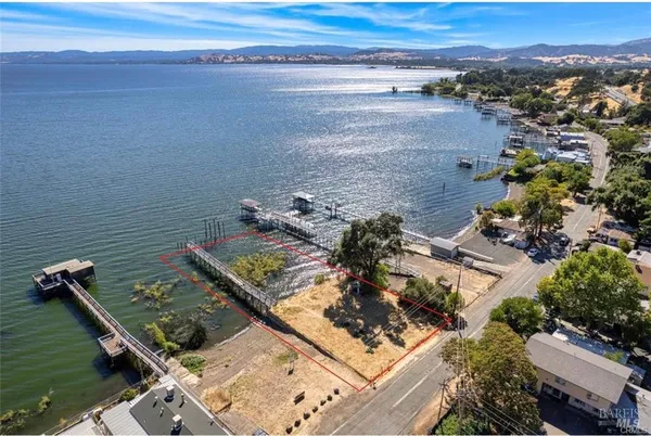 an aerial view of a house with a ocean view