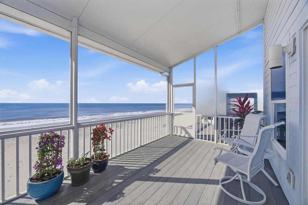 33 South Gulf Boulevard, Unit A Boca Grande, FL 33921 - Photo 15 of 47 a view of a balcony dining room with wooden floor