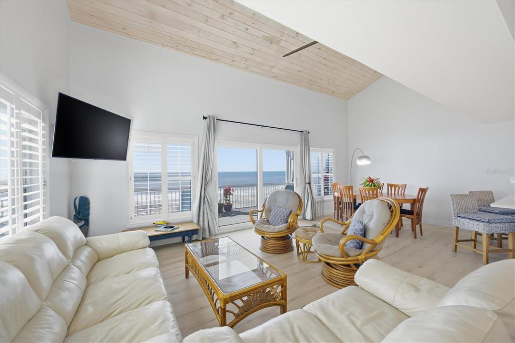 33 South Gulf Boulevard, Unit A Boca Grande, FL 33921 - Photo 20 of 47 a living room with furniture and a flat screen tv