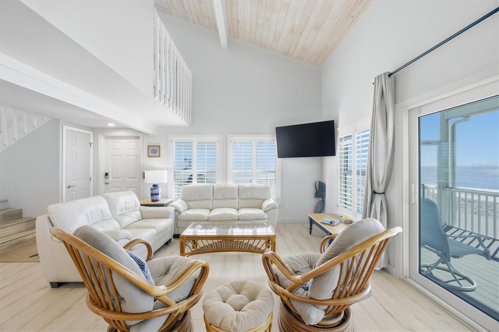 33 South Gulf Boulevard, Unit A Boca Grande, FL 33921 - Photo 22 of 47 a living room with furniture and a flat screen tv