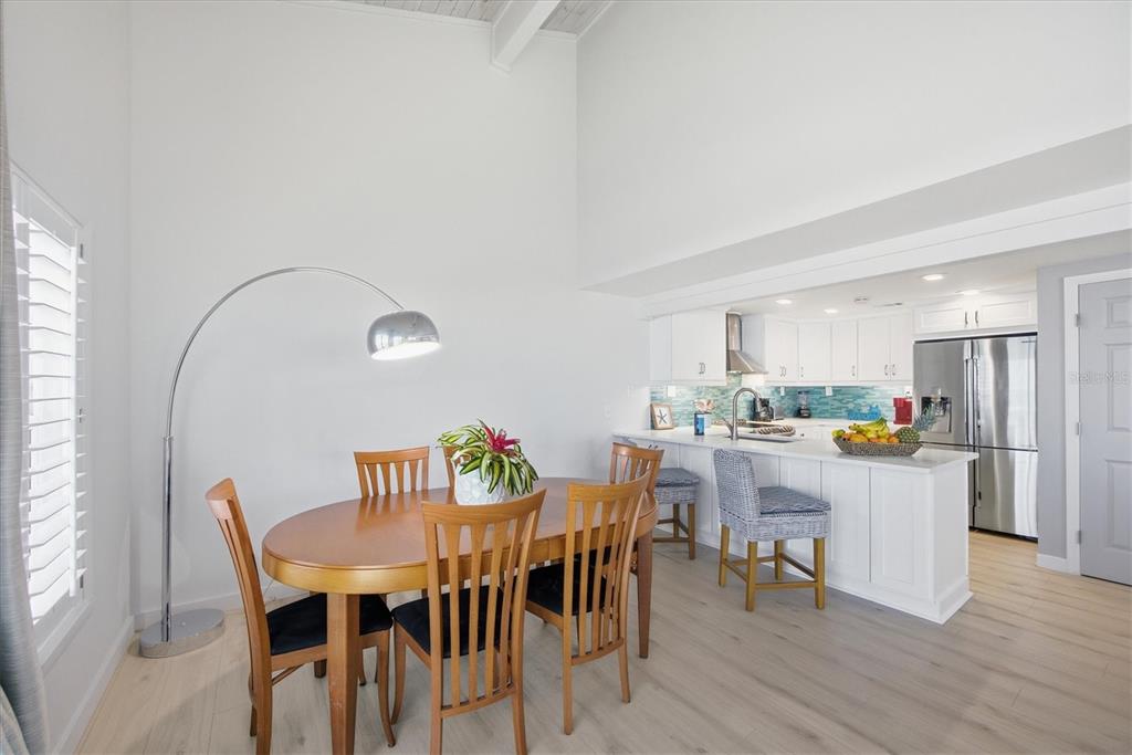 33 South Gulf Boulevard, Unit A Boca Grande, FL 33921 - Photo 25 of 47 a view of a dining room with furniture and wooden floor