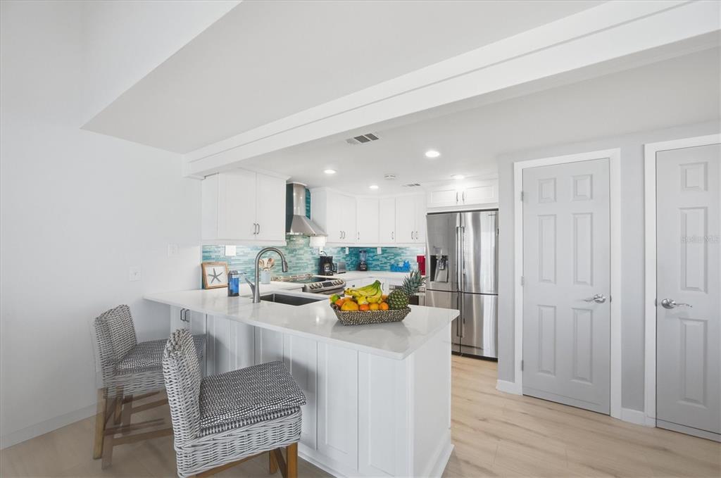 33 South Gulf Boulevard, Unit A Boca Grande, FL 33921 - Photo 26 of 47 a view of kitchen dining table and wooden floor