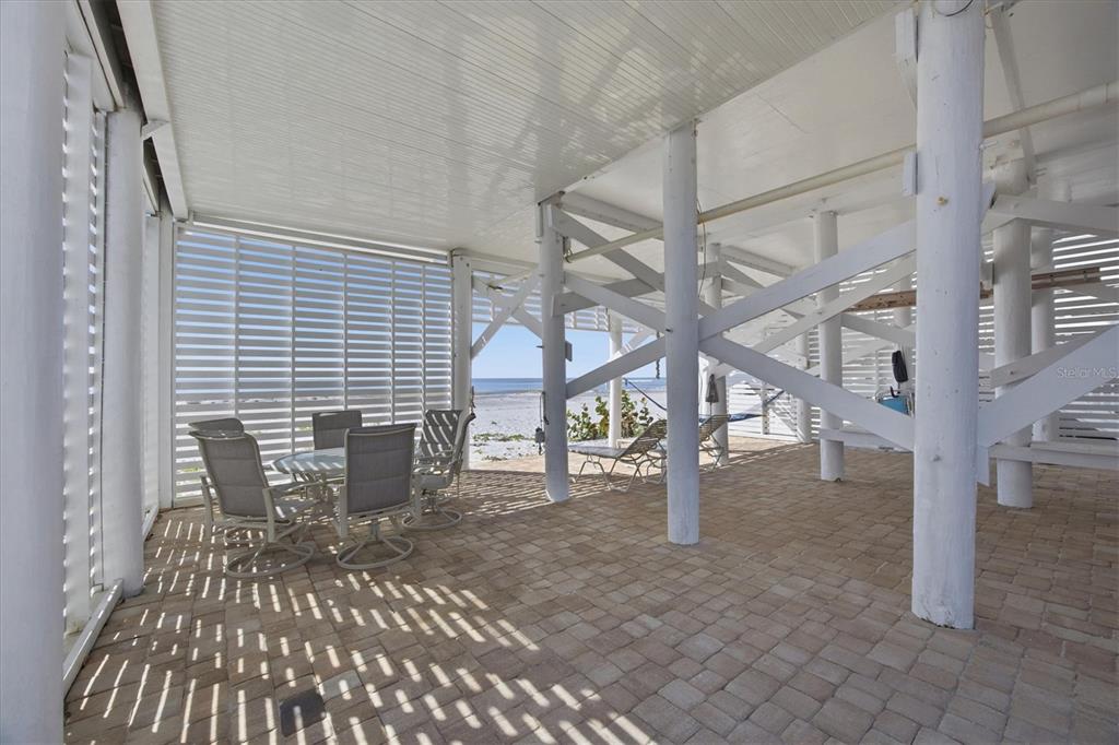 33 South Gulf Boulevard, Unit A Boca Grande, FL 33921 - Photo 42 of 47 a view of a patio with table and chairs