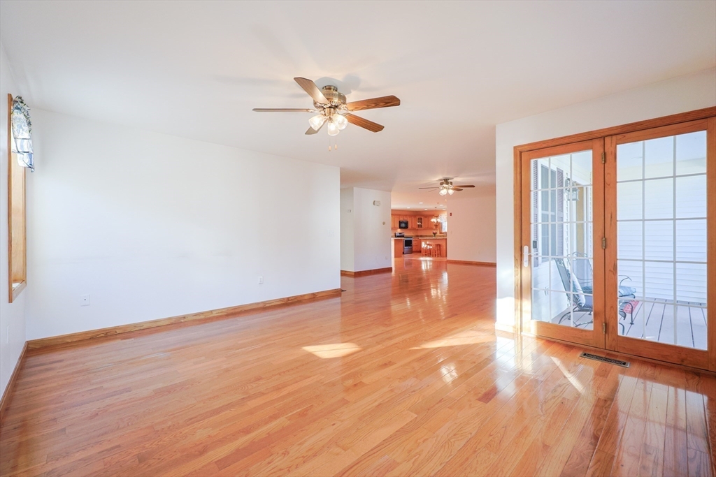 1380 North Brookfield Road Oakham, MA 01068 - Photo 13 of 37 a view of an empty room with window and wooden floor