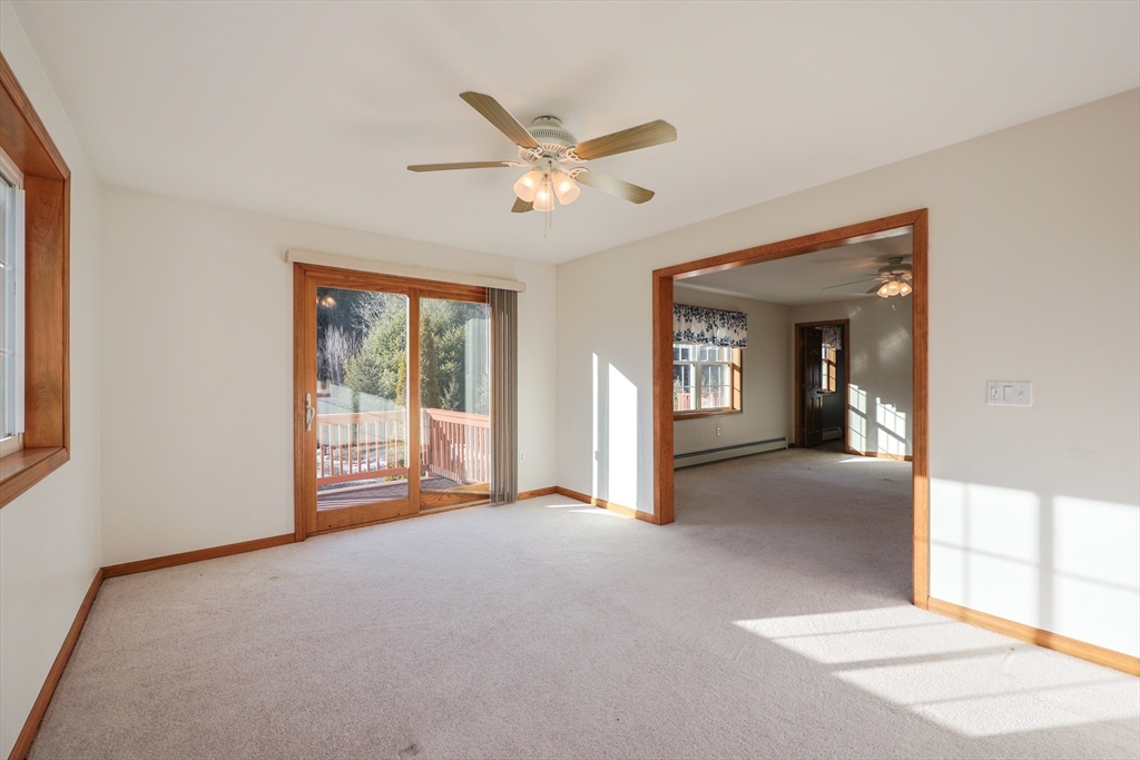 1380 North Brookfield Road Oakham, MA 01068 - Photo 16 of 37 a view of a livingroom with a ceiling fan and window