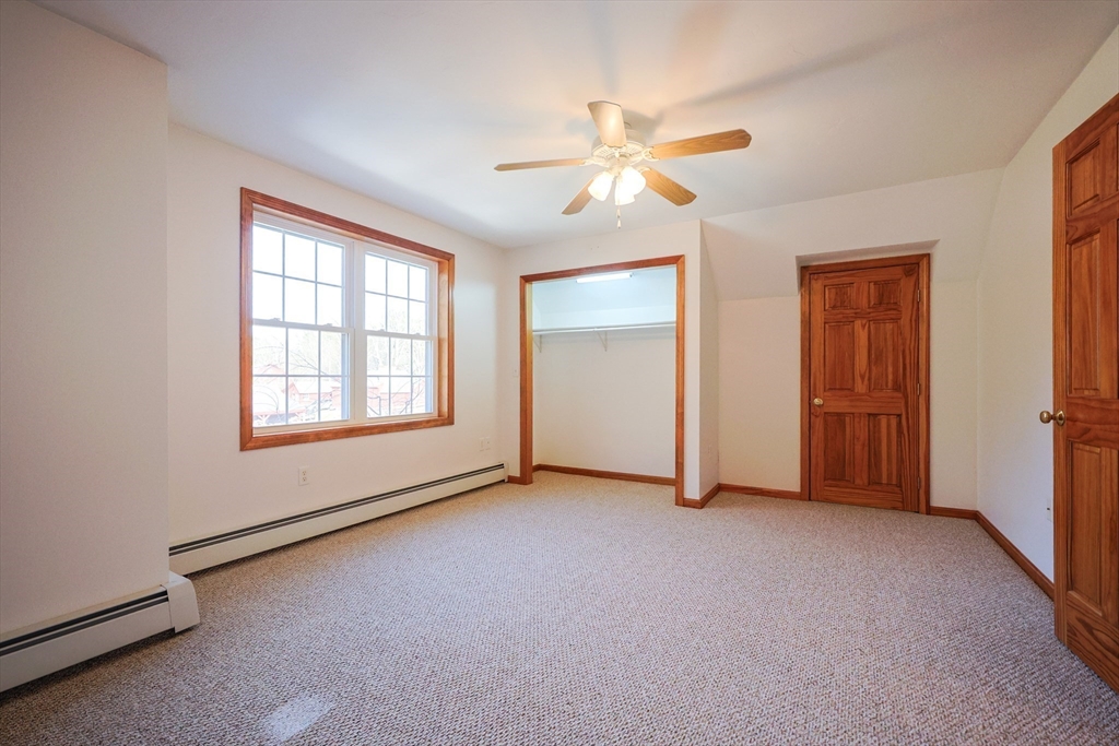 1380 North Brookfield Road Oakham, MA 01068 - Photo 22 of 37 an empty room with windows and fan