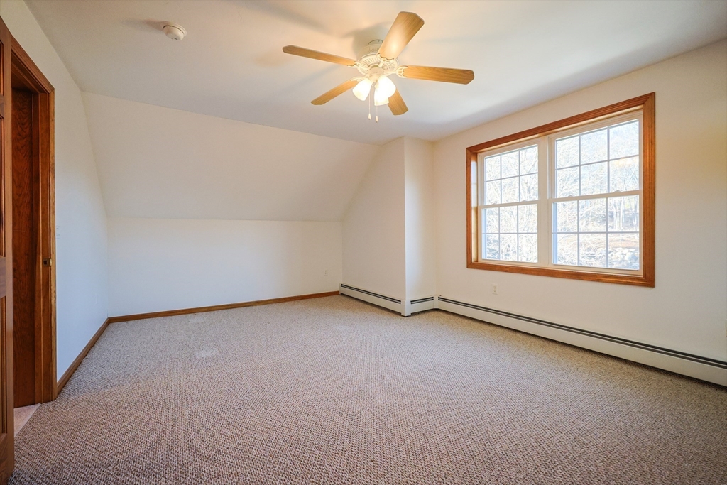 1380 North Brookfield Road Oakham, MA 01068 - Photo 23 of 37 an empty room with windows and fan